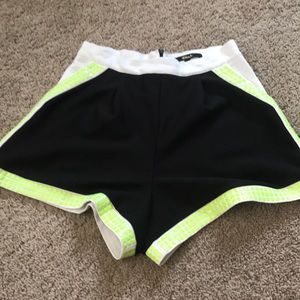 High waisted shorts with green metallic studs